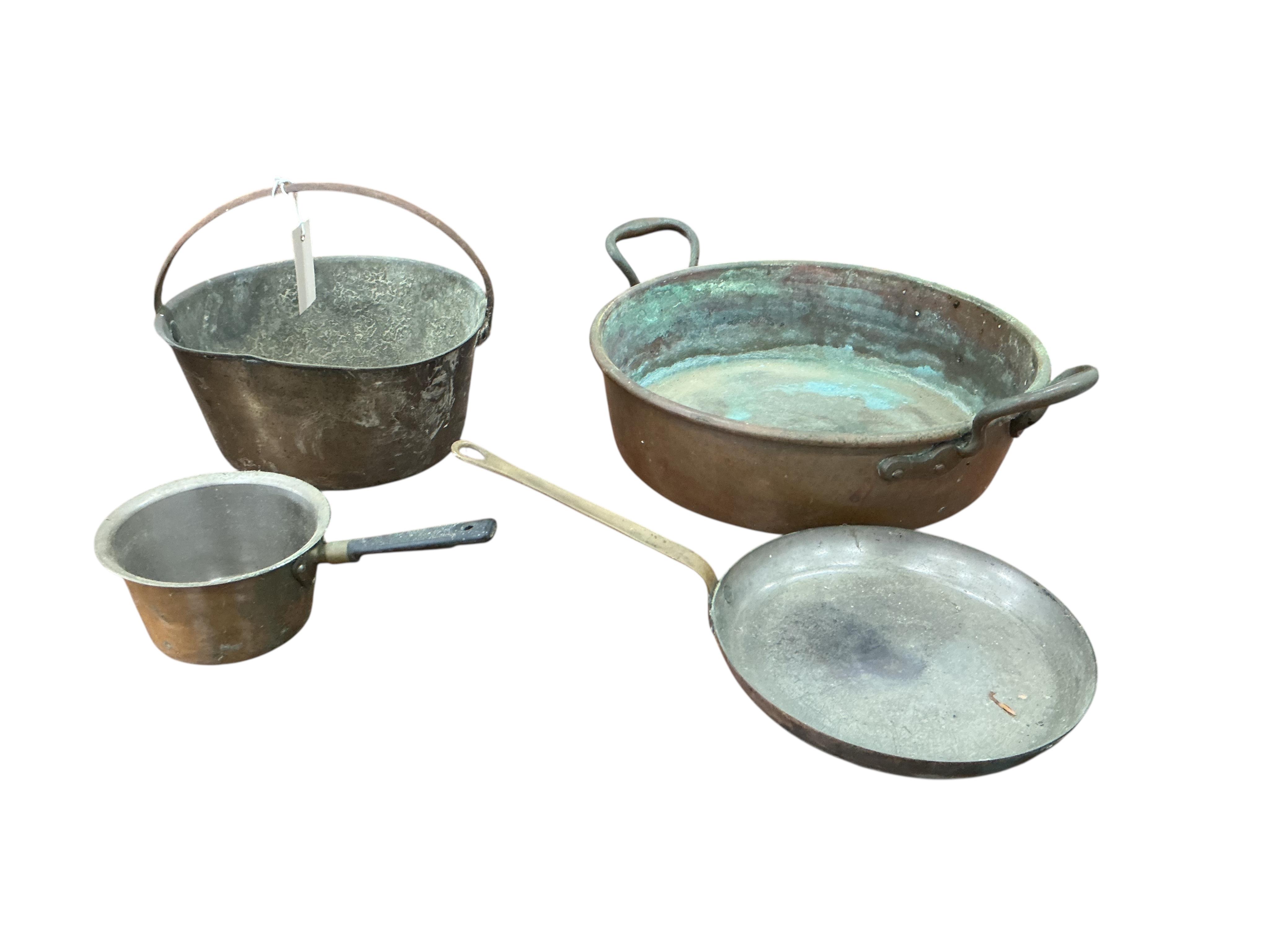 A Victorian brass preserve pan, diameter 48cm and three further pans